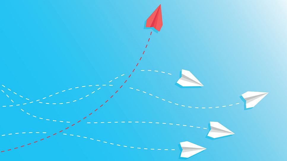 Paper planes flying in different directions representing a change journey story.