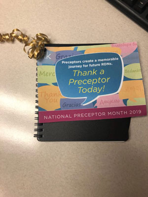 An image of a multi-colored small notebook