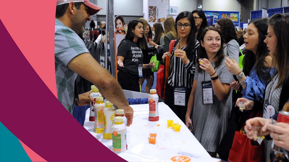 FNCE attendees on the Expo floor