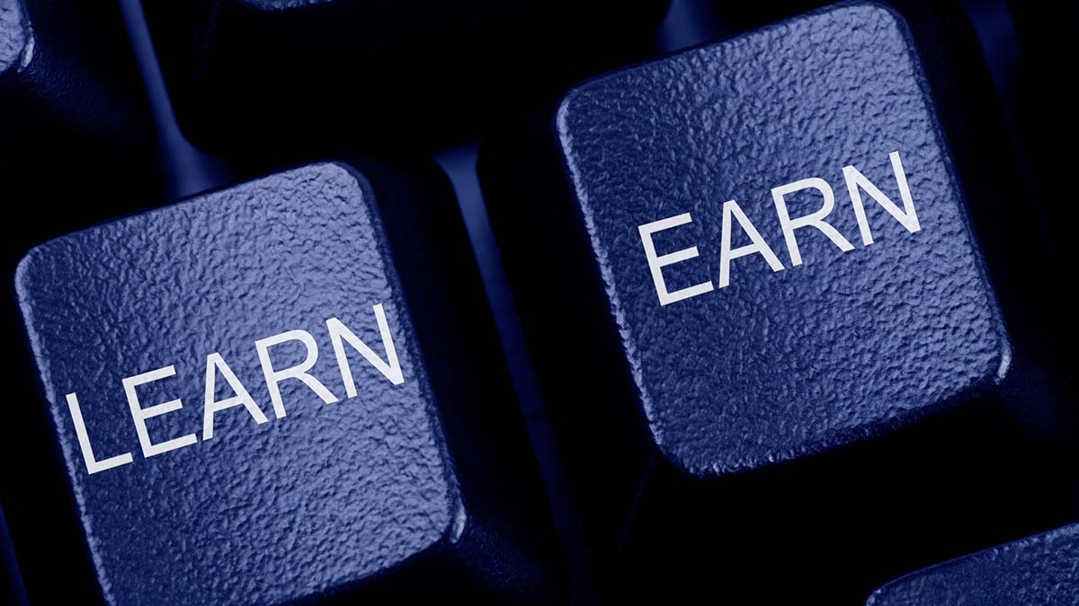 EARN Division | Learn and Earn written on Keys on a Computer Keyboard