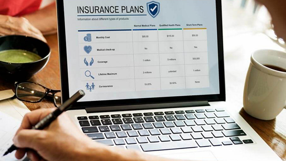 laptop open to screen that reads "Insurance Plans"