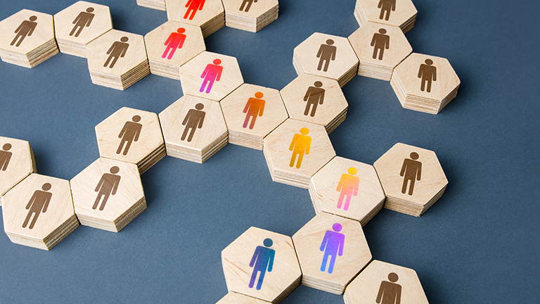 wooden files with silhouettes of people on table