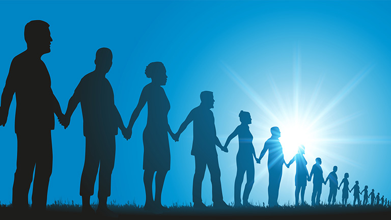 People standing in a row holding hands representing solidarity