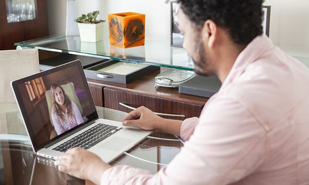 Man getting nutrition support and guidance from a registered dietitian nutritionist (RDN) via telehealth