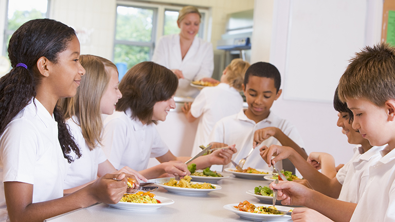 Children eating school lunch provided by foodservice staff RDNs