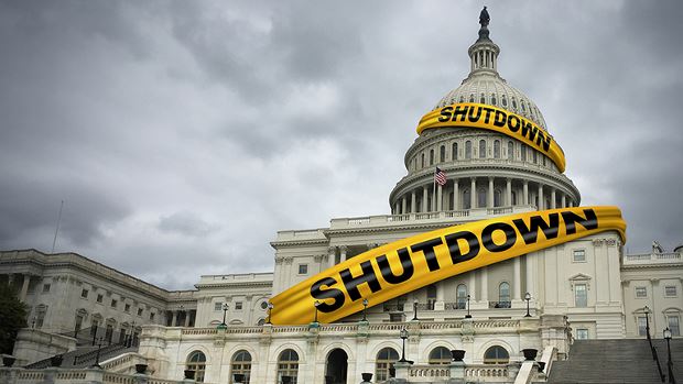 Capitol building with yellow tape wrapped around it