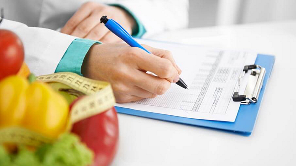 Medical Professional Filling Out Chart