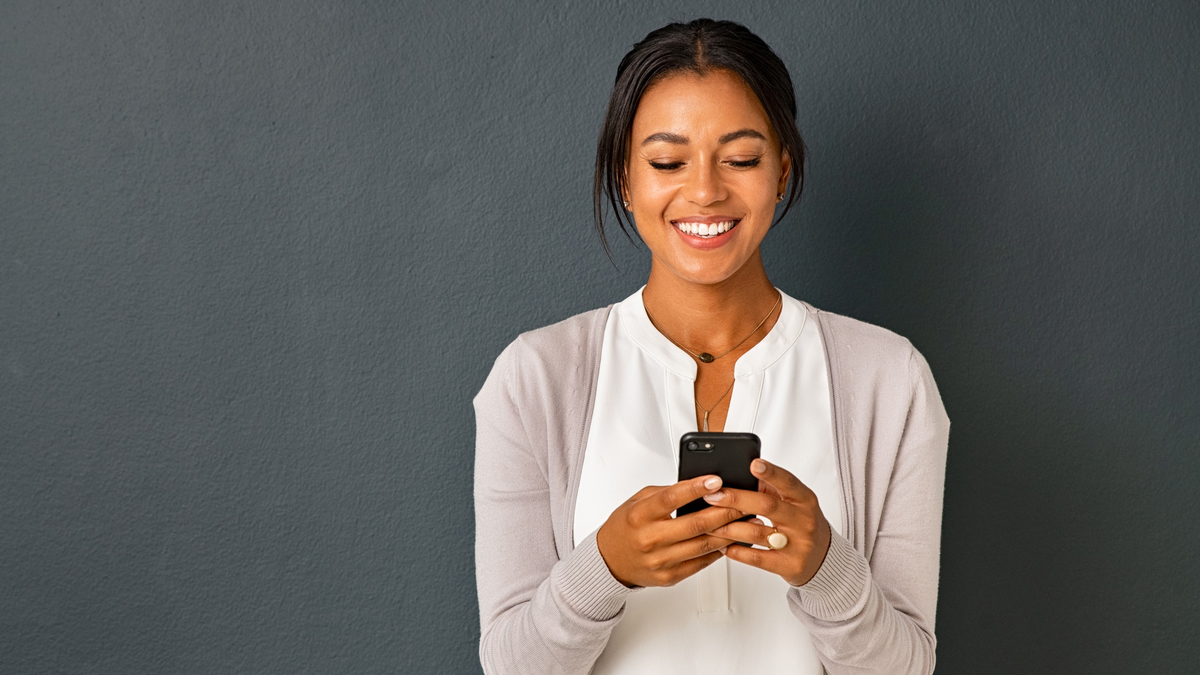 Do you receive Academy updates? | Image of woman looking at phone
