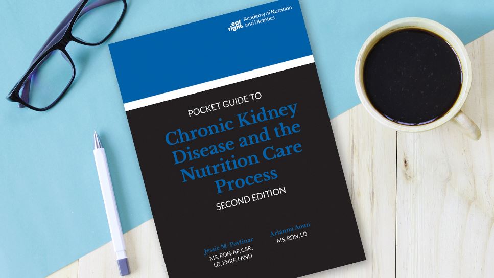 Copy of Pocket Guide to Chronic Kidney Disease and the Nutrition Care Process, 2nd Ed. lying on a desk.