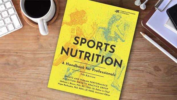 Copy of Sports Nutrition: A Handbook for Professionals, 7th Ed. Laying on a Desk